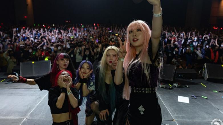 5 Cosplayers selfie on stage
