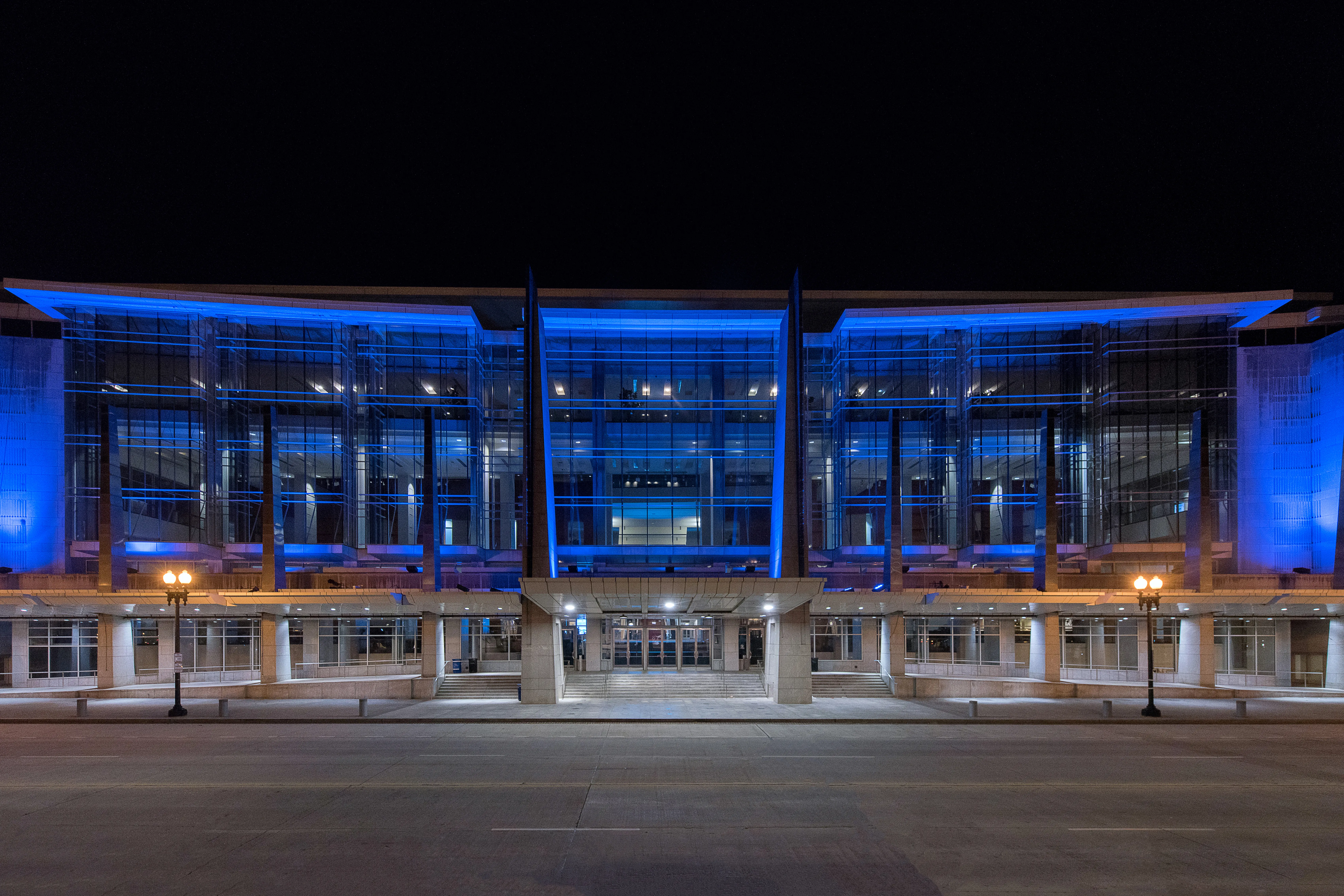 Exterior shot of the Walter E. Washington Convention Center lit blue