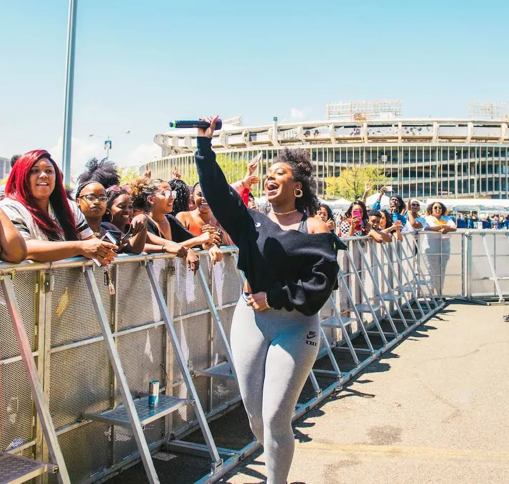 A woman waving at an event